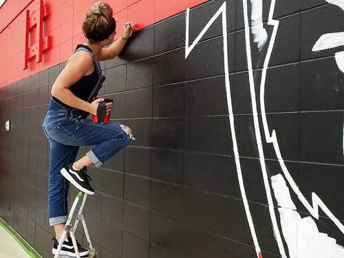 Art on wall, by mural artist. Handpainted artwork.
